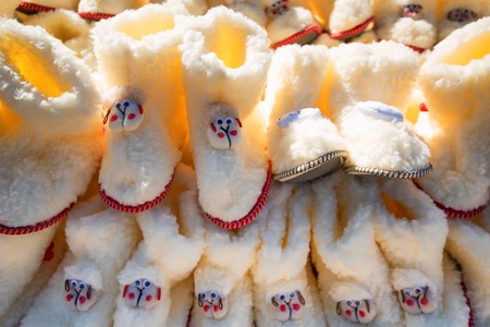 White childrens shoes made of sheeps wool for saleの写真素材