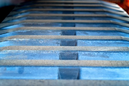 Close up dark used industrial rubber track