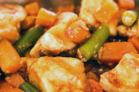 Braised chicken with vegetables close up backgroundの写真素材
