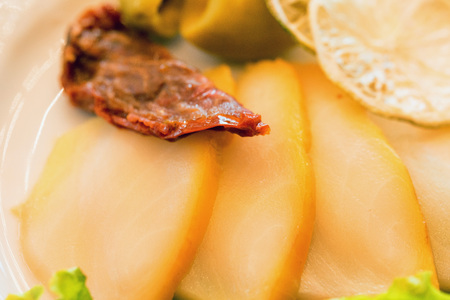 Thin slices of sturgeon fillet on plate closeの写真素材