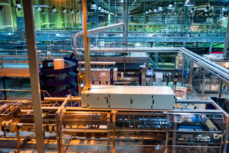 Industrial interior of soft drinks factory with tubes