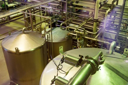 Metal reservoirs at a soft drink factory