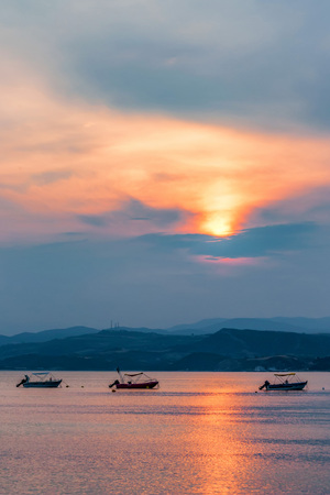 Sunset view of the Mediterranean sea and boats in Halkidiki, Greece.の写真素材