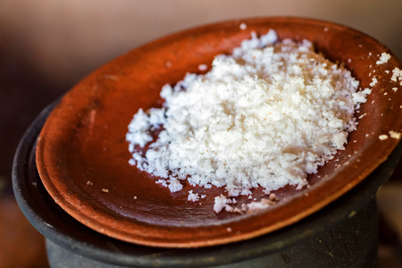 Grated coconut on plate close up imageの写真素材