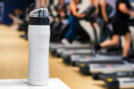 Plastic bottle or cup with fitness drink close upの写真素材