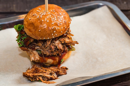 Close up tasty burger with minced meat served on trayの写真素材