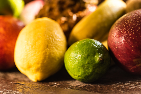 Studio shot of various exotic fruit on woodの写真素材