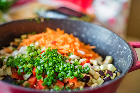 Chopped fresh vegetables in saucepan. Cooking vegetables