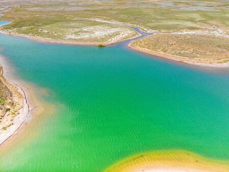 Amazing aerial view of bright green water lake in Bogdo-Baskunchakの写真素材