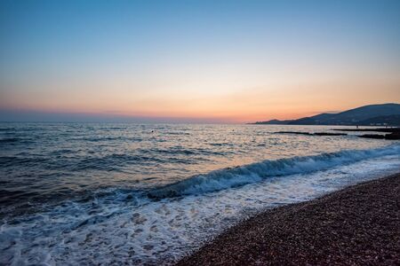 Pebble beach at sunset. Beautiful natural landscapeの写真素材