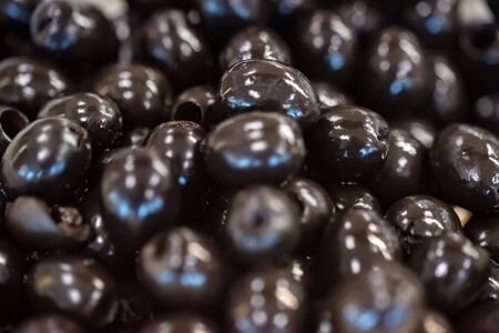 Canned black pitted olives for abstractの写真素材