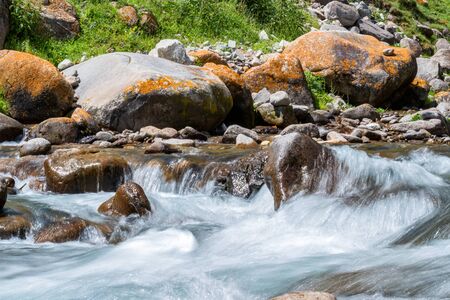 Beautiful peaceful view of water in mountain river. Slow shutter speedの写真素材