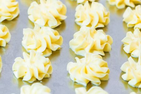 Close up decorative portions of butter at buffet table