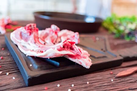 Raw lamb ribs on kitchen table ready to be cooked