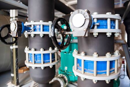 Close up black valves plug on plastic pipe