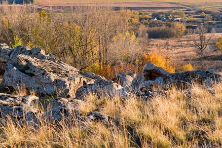 Beautiful view of Don steppe in autumn lit by setting sunの写真素材