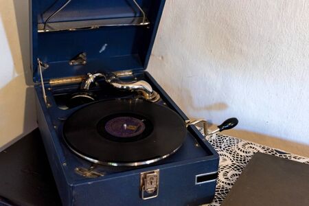 Vinyl record played on old retro vintage phonographの写真素材