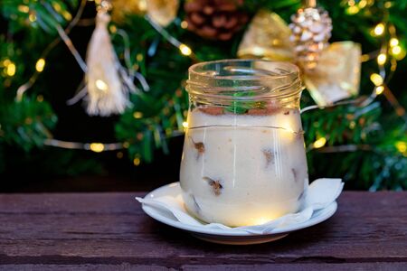 Close up delicious tiramisu dessert in glass jarの写真素材