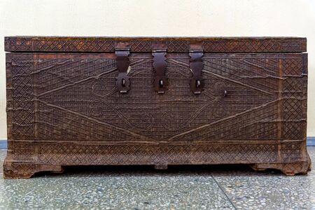 Close view obsolete dark brown metal chest with hingesの写真素材