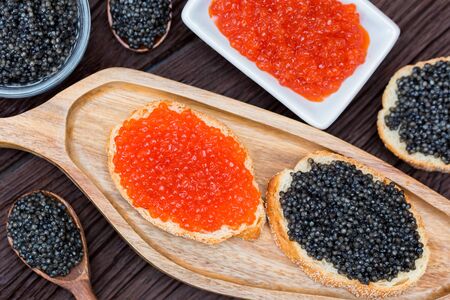 Sandwiches with black sturgeon and red salmon caviar close upの写真素材
