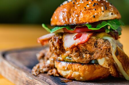 Close up tasty burger with minced meat served on trayの写真素材