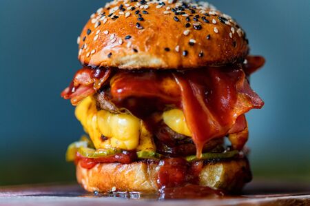 Freshly cooked delicious burger with minced meat served in restaurant. Fast food concept. Selective focusの写真素材