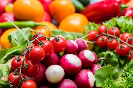 Fresh vegetables and herbs on wooden tableの写真素材