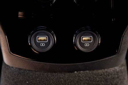 Close up of two car interior usb charging cable connectionの写真素材