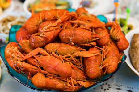 Close up of cooked crayfishes in plate on table