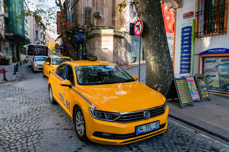 ISTANBUL, TURKEY - 9 DECEMBER 2020: Typical yellow taxi car on street Istanbul