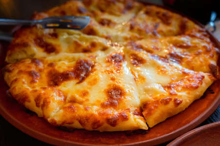Close up of fresh Ossetian pie with double cheese