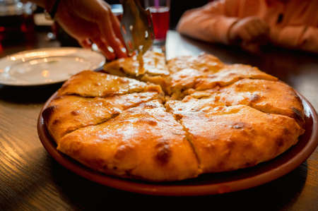 Close up of fresh Ossetian pie with beef meat