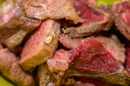Close-up of chopped raw pork pieces with seasoningの写真素材