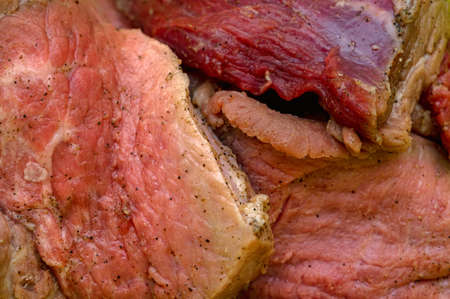 Close-up of chopped raw pork pieces with seasoningの写真素材