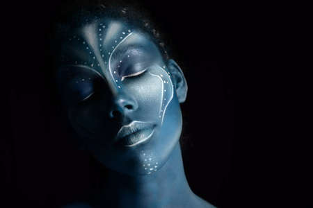 Art photo of Africal woman with tribal ethnic paintings in Avatar style