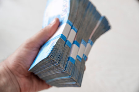 Russian rubles in the male hands, cash pay, salary or shopping concept