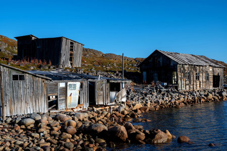View of abandoned small house on the river bank.の写真素材