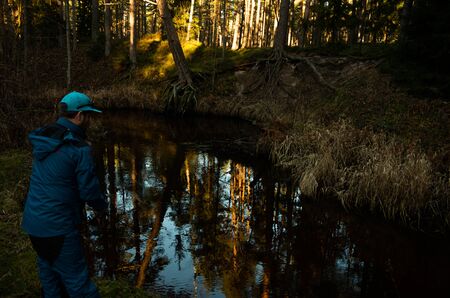 Fisherman angler  fishing forest river blue costumeの写真素材