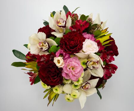 Flower composition, handmade by florists with roses and orchids.の写真素材