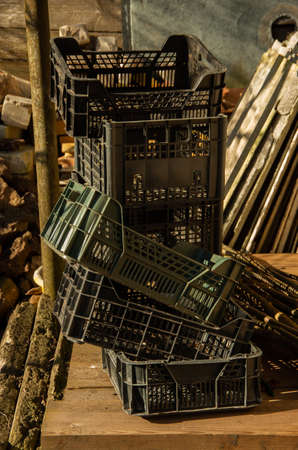 Various garden plastic boxes on a wooden platform, garden jobのeditorial素材