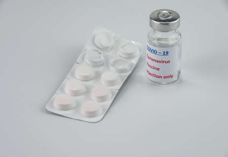 Medical pills and vaccine on whiteの写真素材