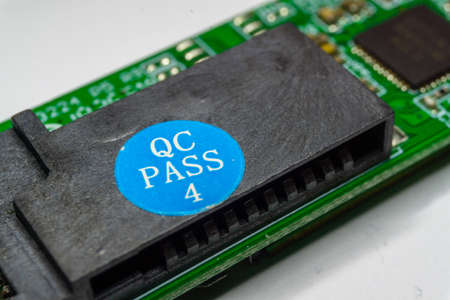 Quality assurance label from consumer electronics assembly industry to guarantee customer satisfaction through defect control and detailed inspectionの写真素材