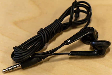 Isolated close up of cable management for black with 3.5mm jack earphonesの写真素材
