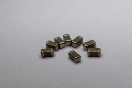 Abstract close-up of surface mount electronics components in symbolic pattern for leadership and...