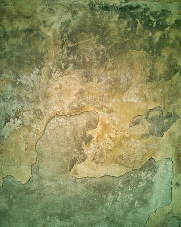 Abstract colorful isolated close-up of brown aged concrete signs of weather and time wear before restorationの写真素材