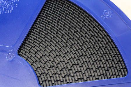 Blue reel of smt surface mount electronic devices packed for mass production in electronics factoryの写真素材