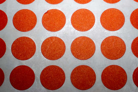 Array close-up of blank red circural multi purpose labels white background used in retail and 5s quality assurance for warning and attention drawing purpose.の写真素材