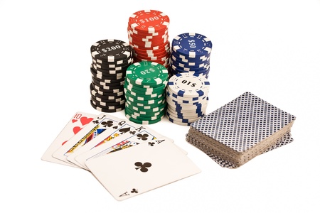 Bunch of casino chips, deck of cards and poker straight isolated on white.のeditorial素材