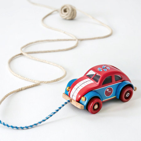 toy car on a white background with rope. toy car on a white backgroundの素材