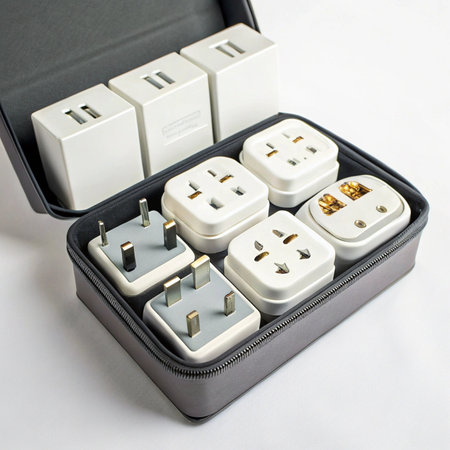 Set of white power plugs in a black box on a white backgroundの素材